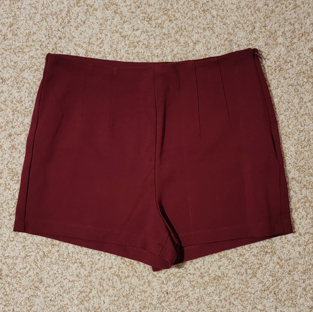 Red pleated shorts